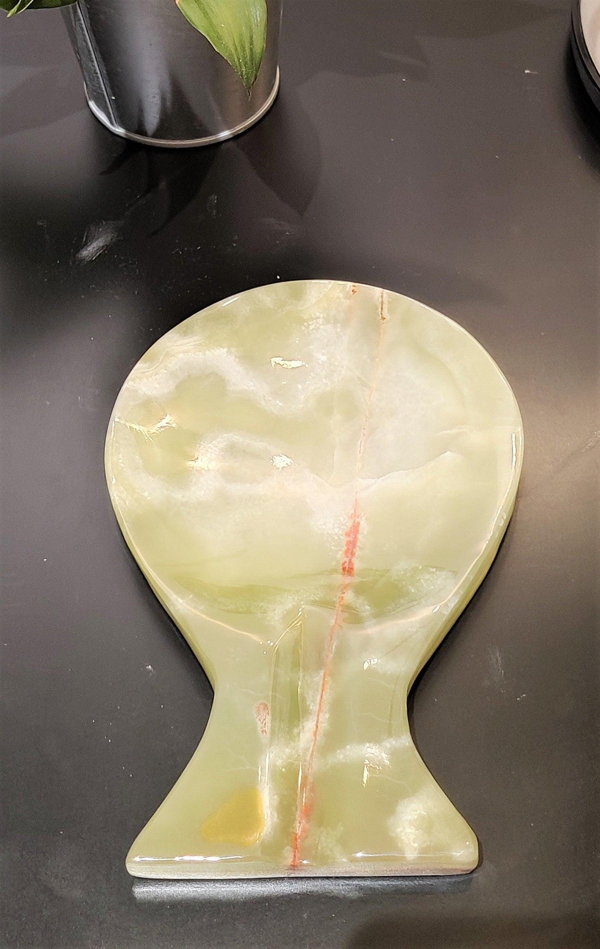 Close-up of green onyx spoon rest