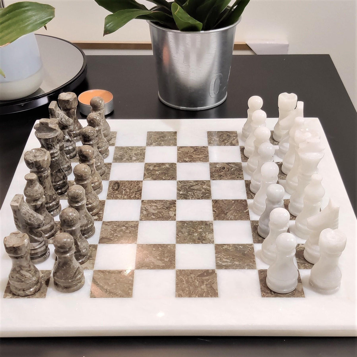 Close front view of white and natural grey chess set
